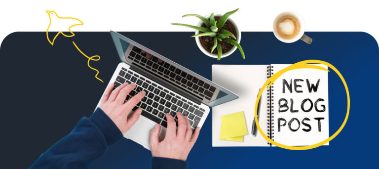 New Blog Post Written On Notebook Next To Laptop