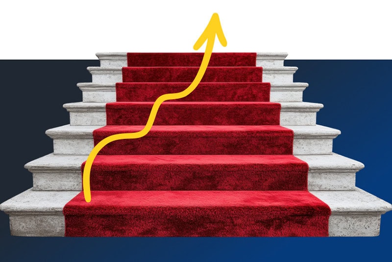 Red Carpeted Staircase With Arrow Pointing Up