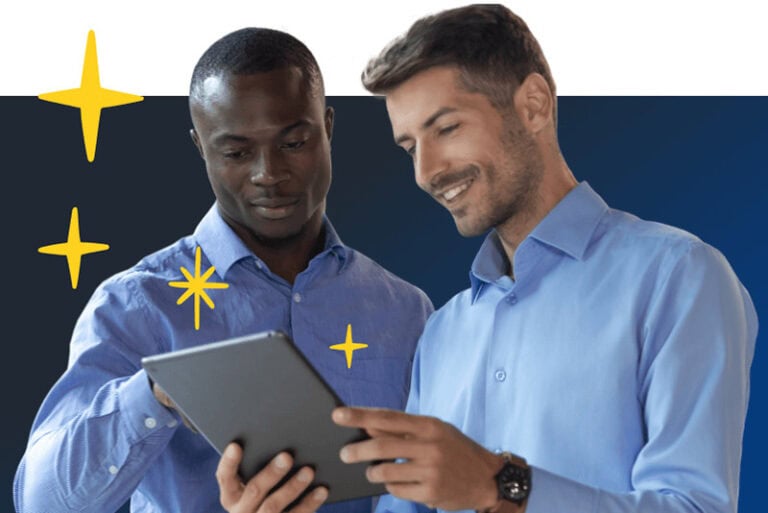 Two Men Looking At A Tablet
