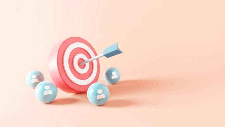 Cartoon target with blue arrow on bullseye surrounded by people icons.