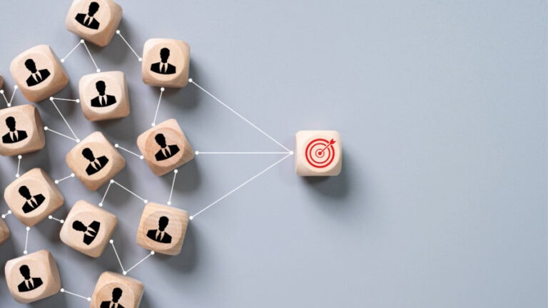 block with red target on it connected by lines to blocks with people icons