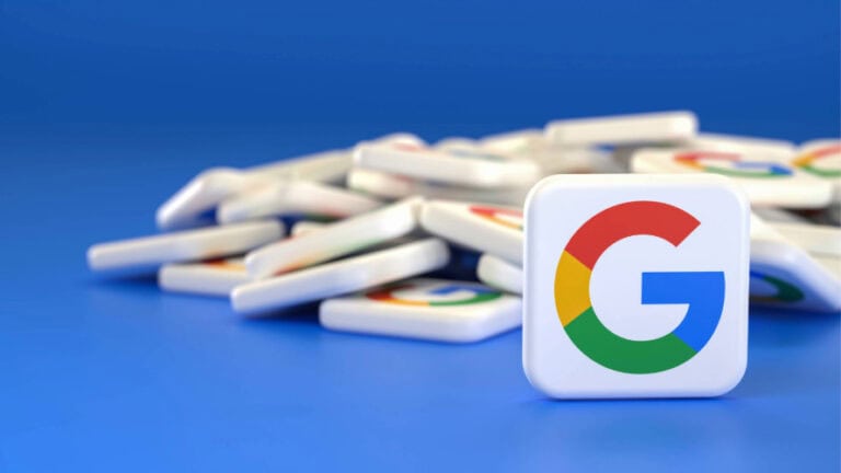 Pile of white square tiles with Google G logo on them.