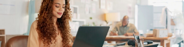 Woman typing on laptop