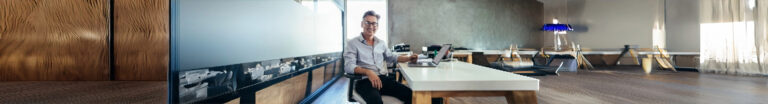 Man sitting in office at desk