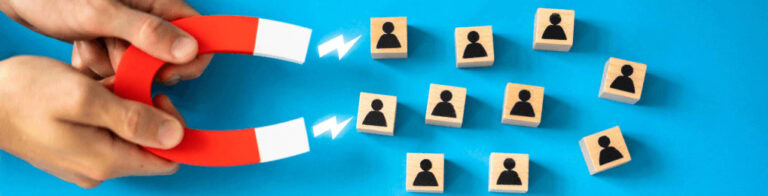 magnet attracting wooden blocks with people icons on them