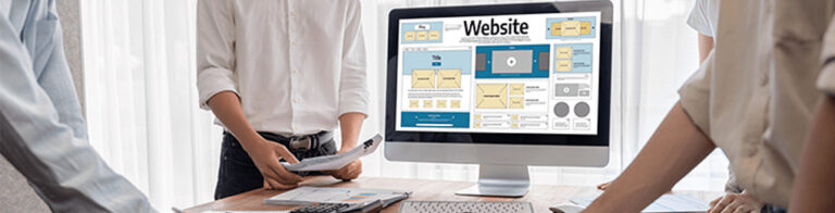 people working on a website’s layout at a conference table