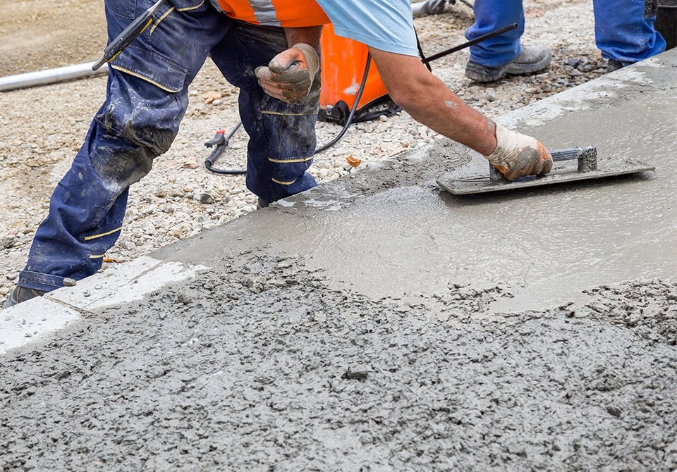 Concrete Worker Smoothing Fresh Slab